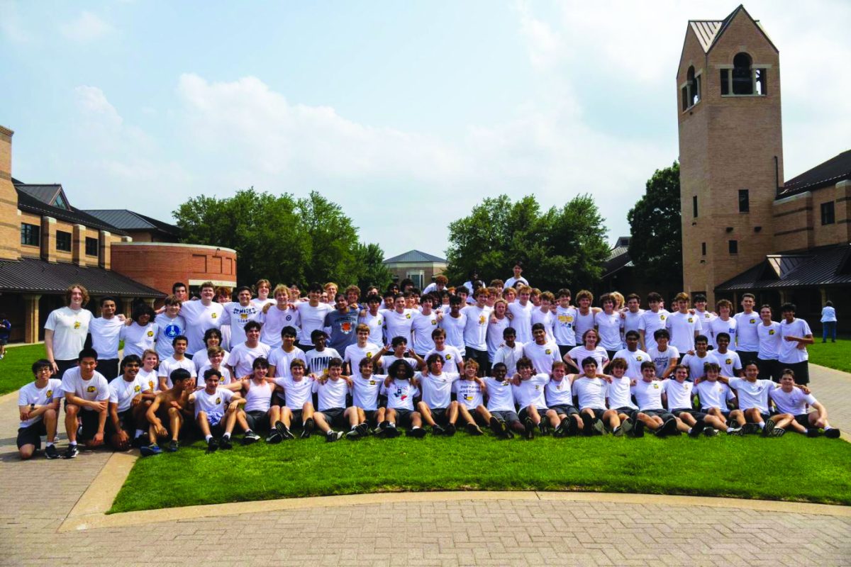 The Class of 2023 poses after hanging up their blue school shirts, a symbolic gesture representing the beginning of a new chapter of their lives.