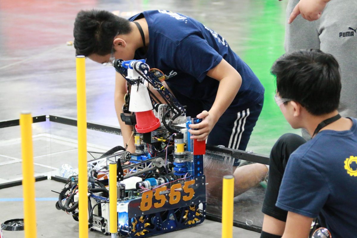 Sophomore Andrew Ye working on the robot during the world championship competition