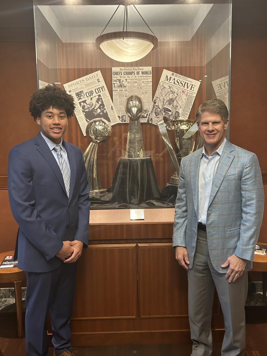 Sports Editor Lawrence Gardner poses with Chiefs owner Clark Hunt in front of the Lombardi trophy.