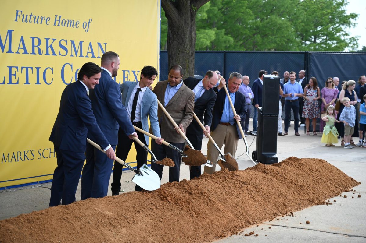 READY TO WORK Program participants put their shovels in the dirt, the sign of a new era in athletics.