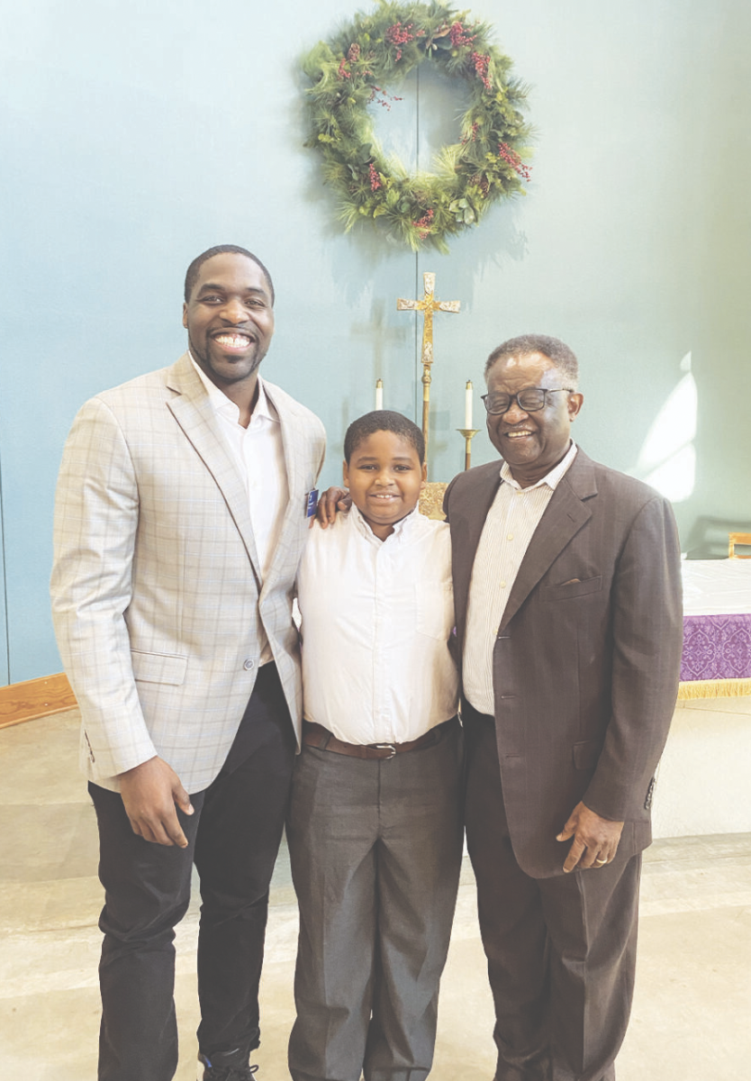 Sam Acho 07 stands with his dad, Sonny, and third grade son, Sam, after singing in chapel. 