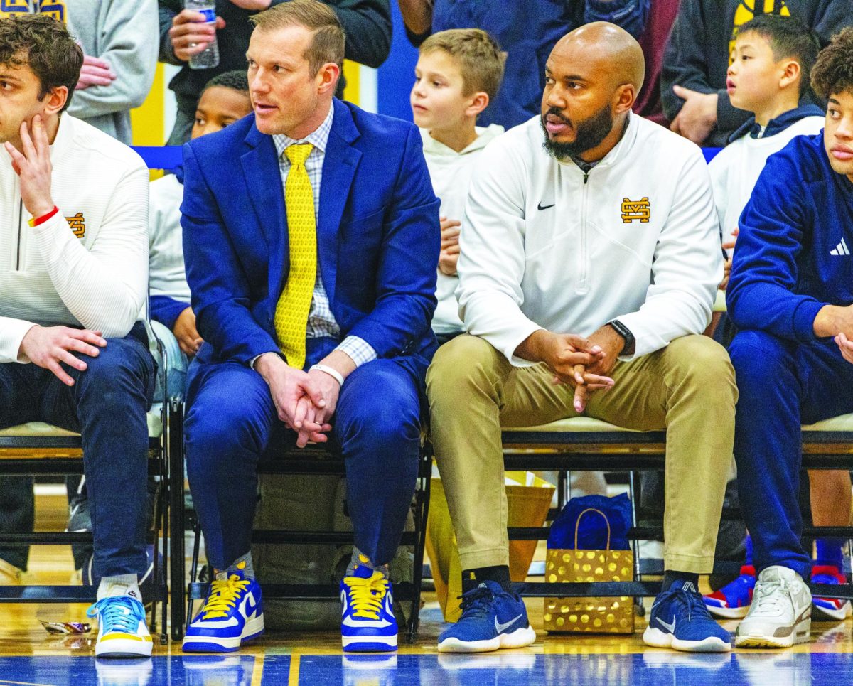 Both Coach Guiler and Coach Brewer took their fathers coaching experience to heart, as they now share a bench as key parts of the Lions basketball coaching staff.