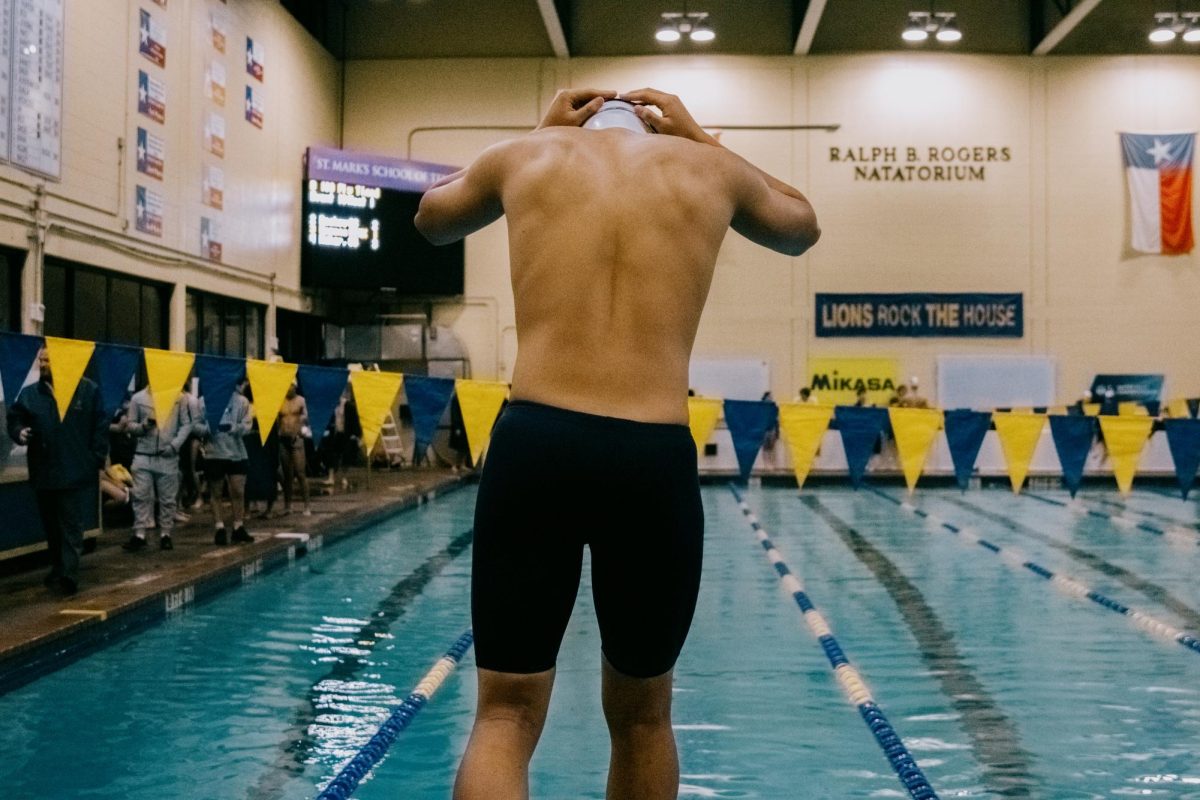 Sophomore Michael Yang gets ready to dive into the pool. 