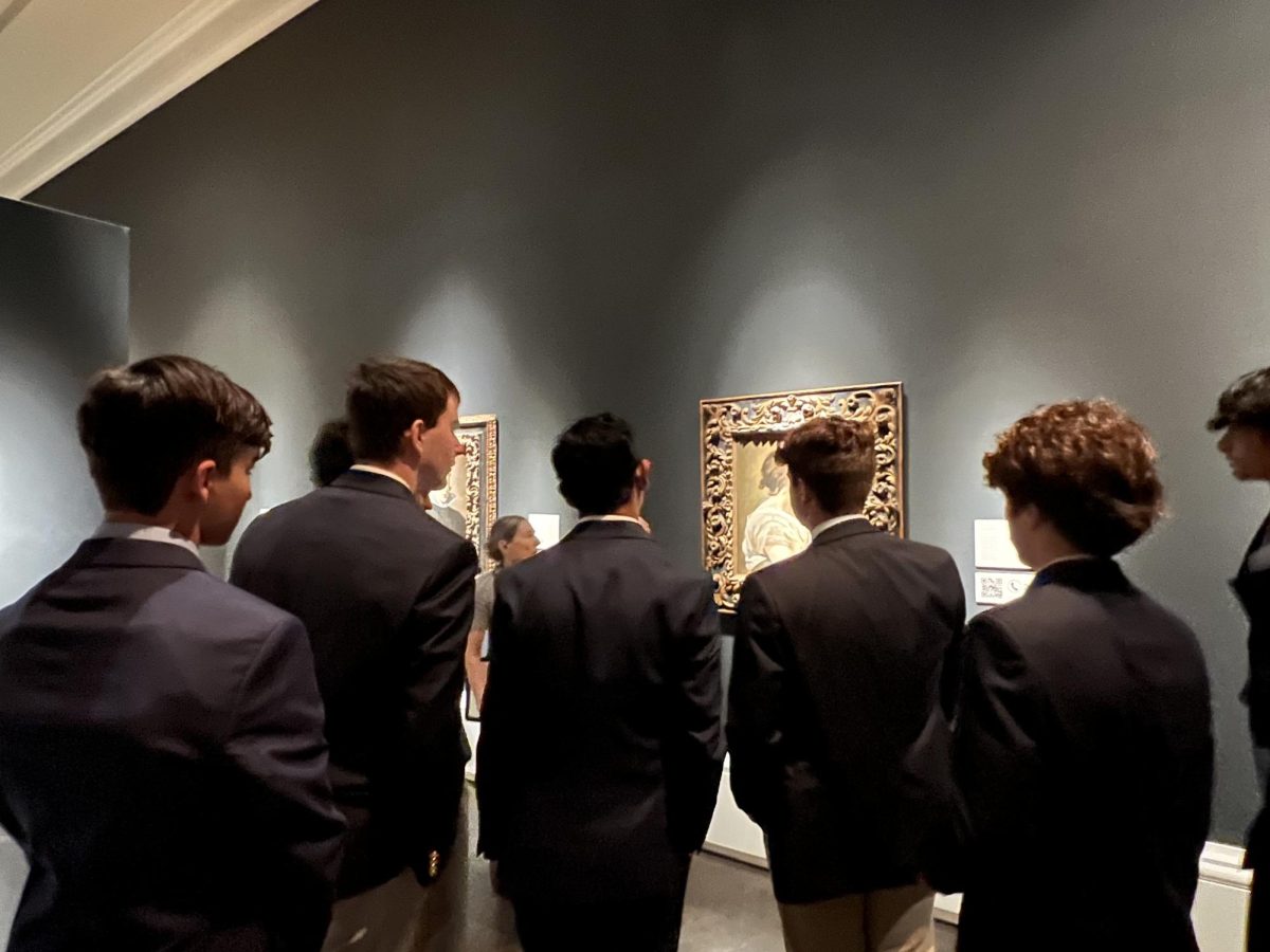Students view a painting at the Meadows Museum