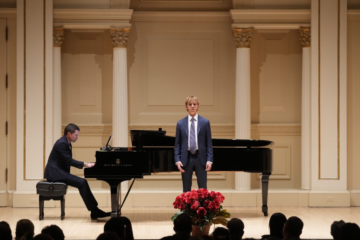 Junior Lukas Palys is accompanied on stage by his accompanist Matthew Lobaugh at Carnegie Hall.   