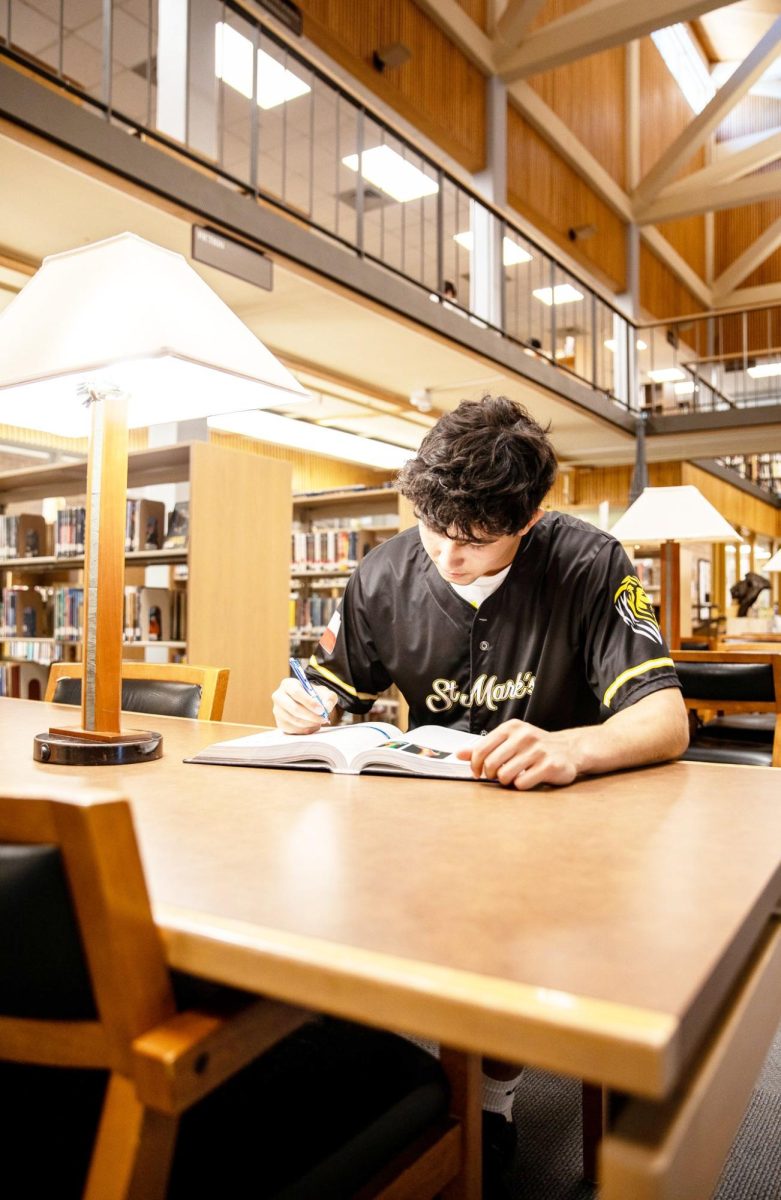 WORK HARD, PLAY HARD Senior football and basketball player Lucas Blumenthal studies to keep up with his rigorous courseload offered at St. Mark’s.