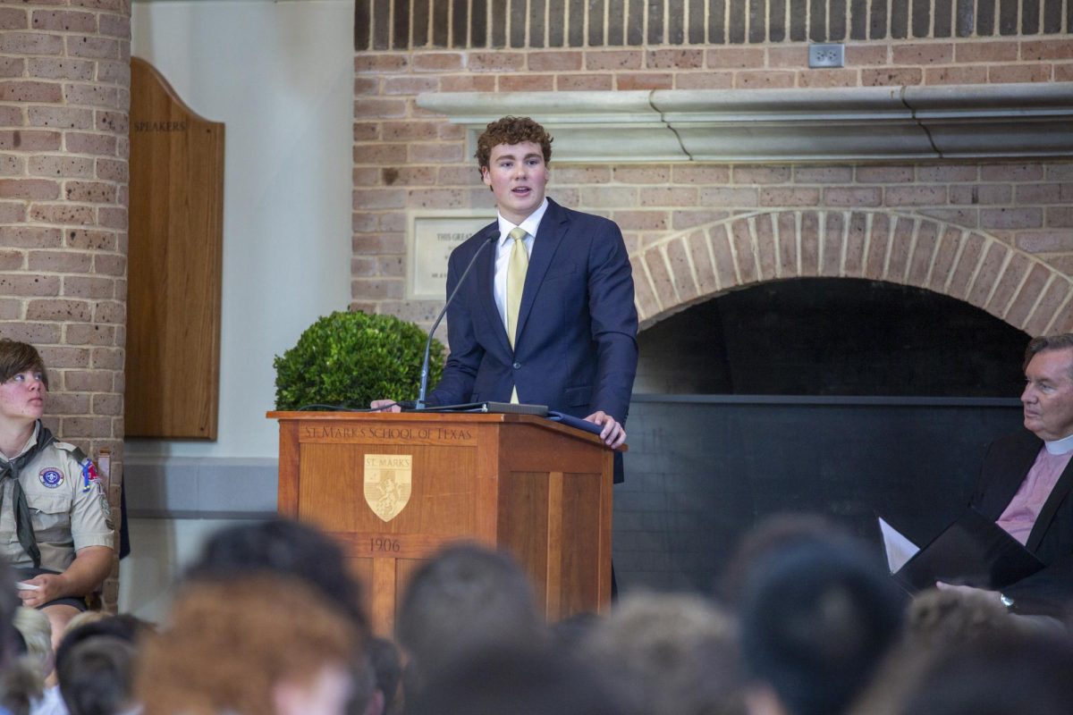 Student Council President Matthew Hofmann addresses the school during convocation