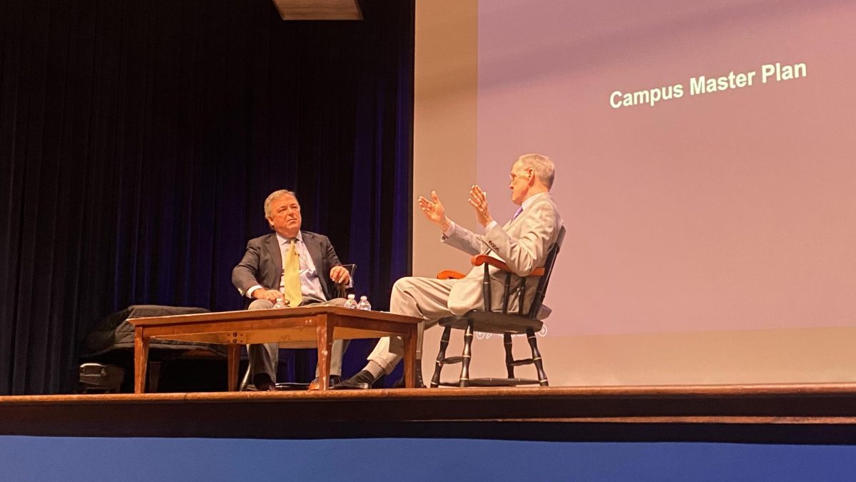 Decherd and Dini speak at the upper school assembly.