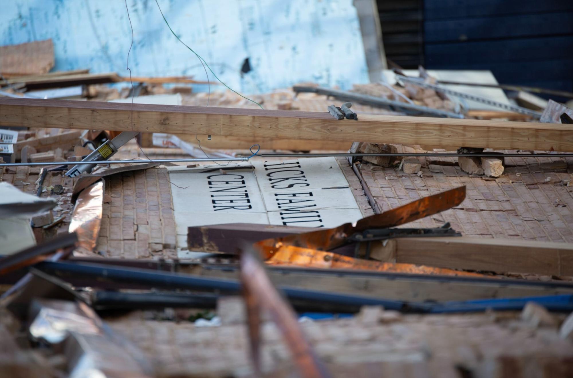 The sign of Hicks Gym lies among the ruins of the building.