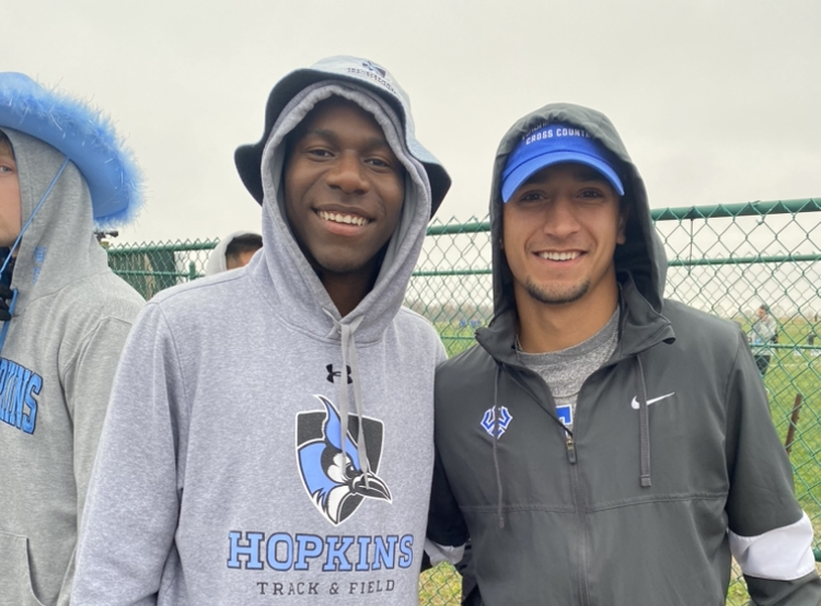 Raja Mehendale '24 (right) raced for Washington and Lee and met with Fisayo Omonije '21 (left) who was supporting his teammates at Johns Hopkins. 