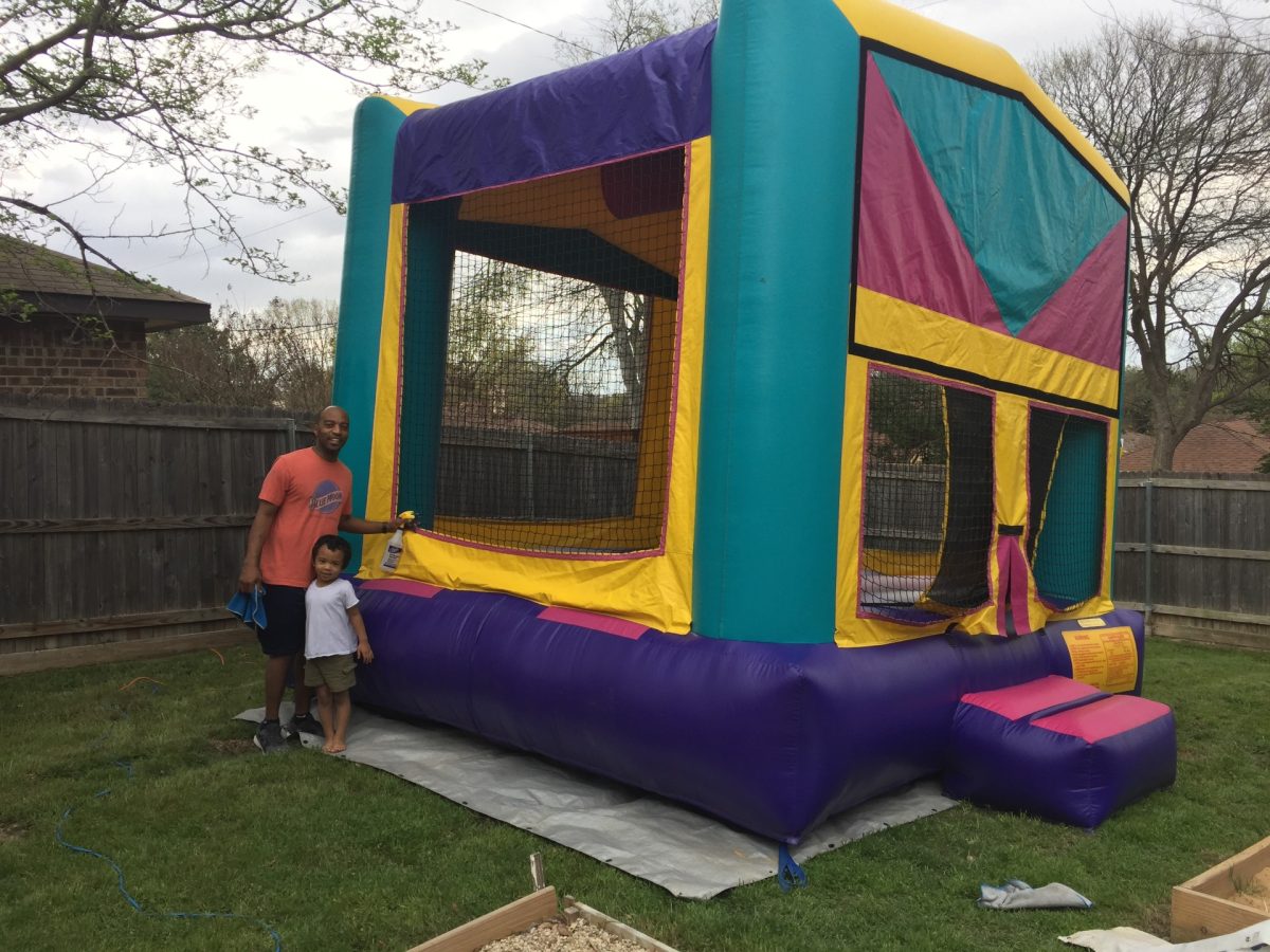 Korey Mack sets up bounce-houses with his children for various events across the  year. 