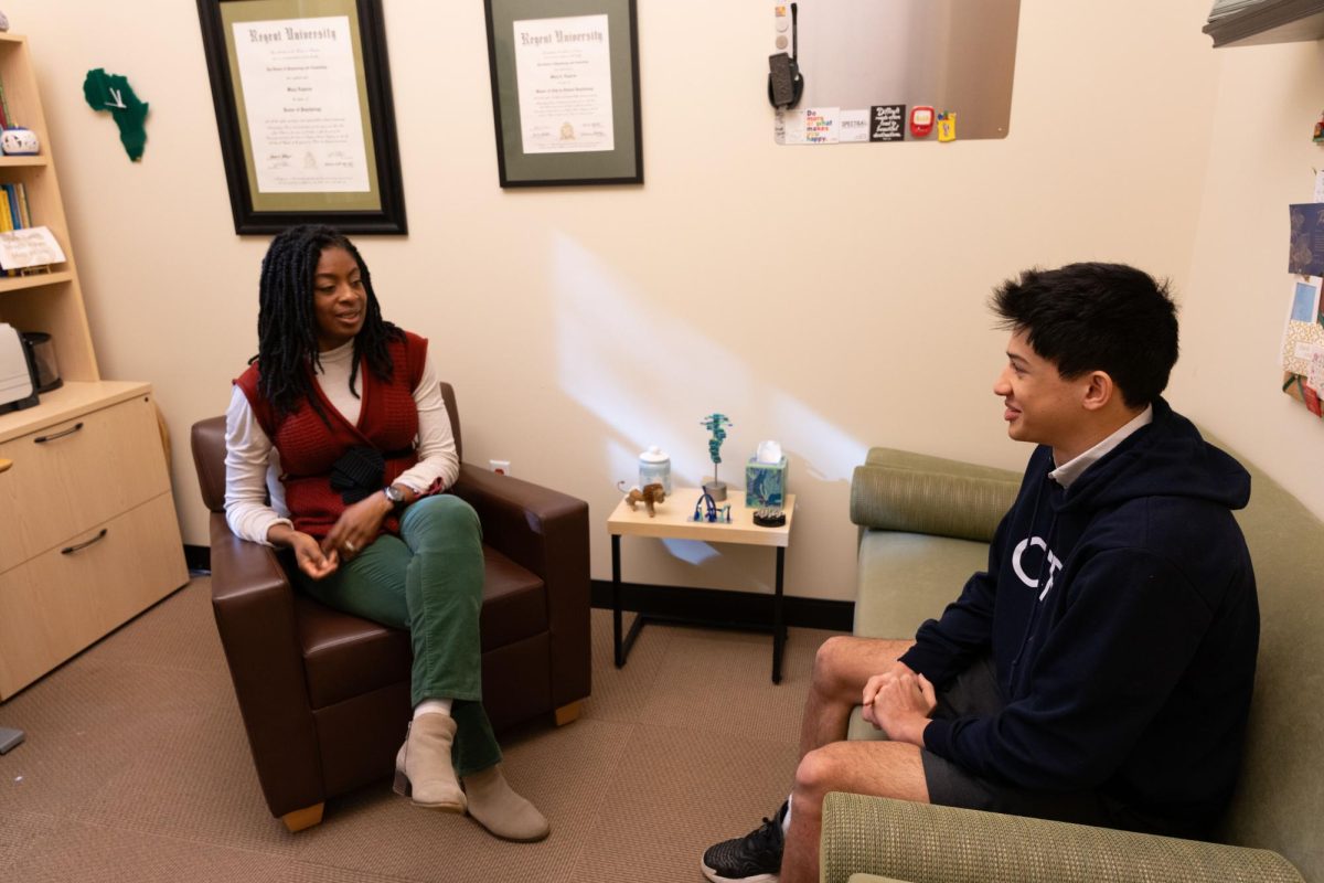 Junior Sanjay Bohil talks with Upper School Counselor Mary Bonsu