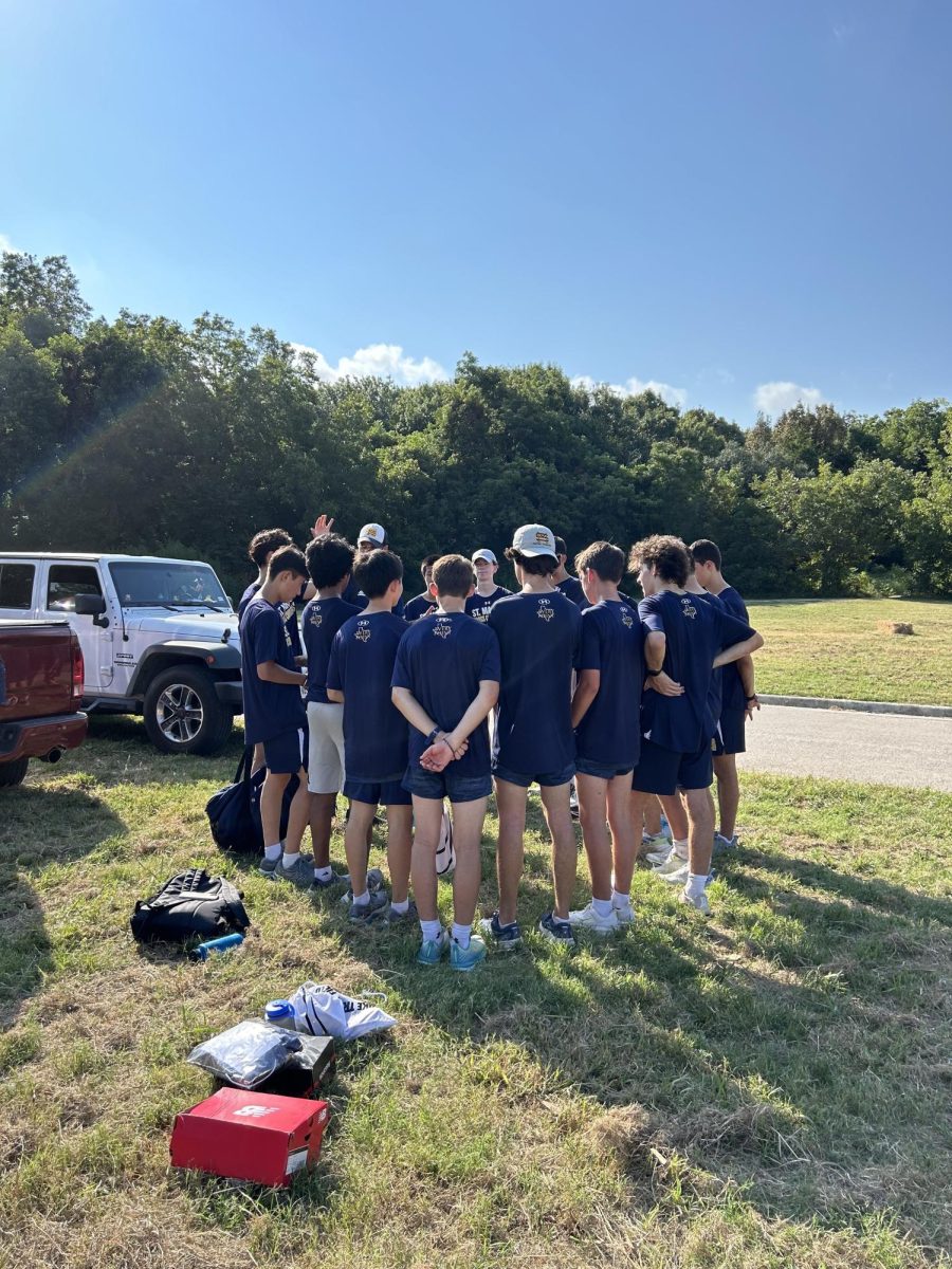 After the cross country team's first meet, Senior Will Clifford shares an encouraging message with his teammates. 