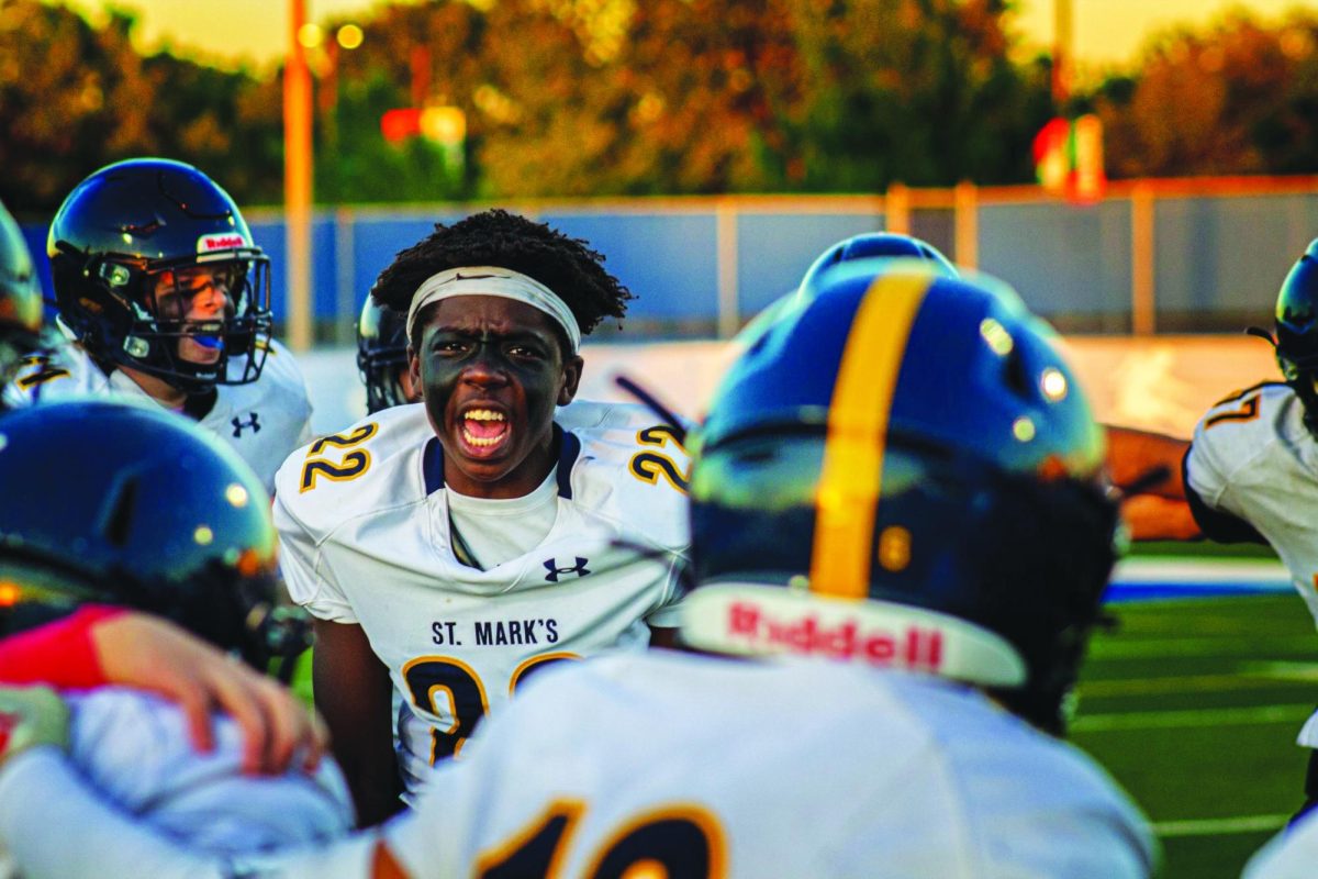 Sophmore David Dickson hypes up his teammates in preperation for an eighth grade football game,a leadership role he will reassume next year as a captain of the varsity team 