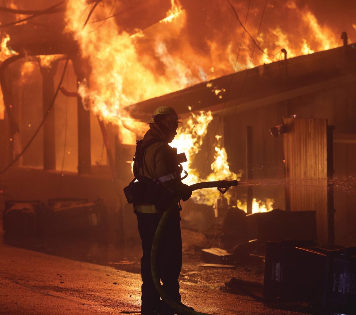 Firefighters battle the flames of the Palisades Fire spreading through LA.