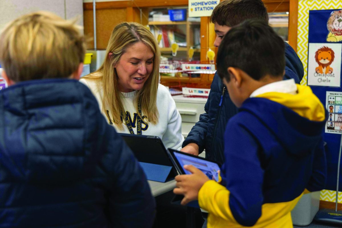 Lower School computer science instructor Aimee Whitaker handles an in-class assignment.