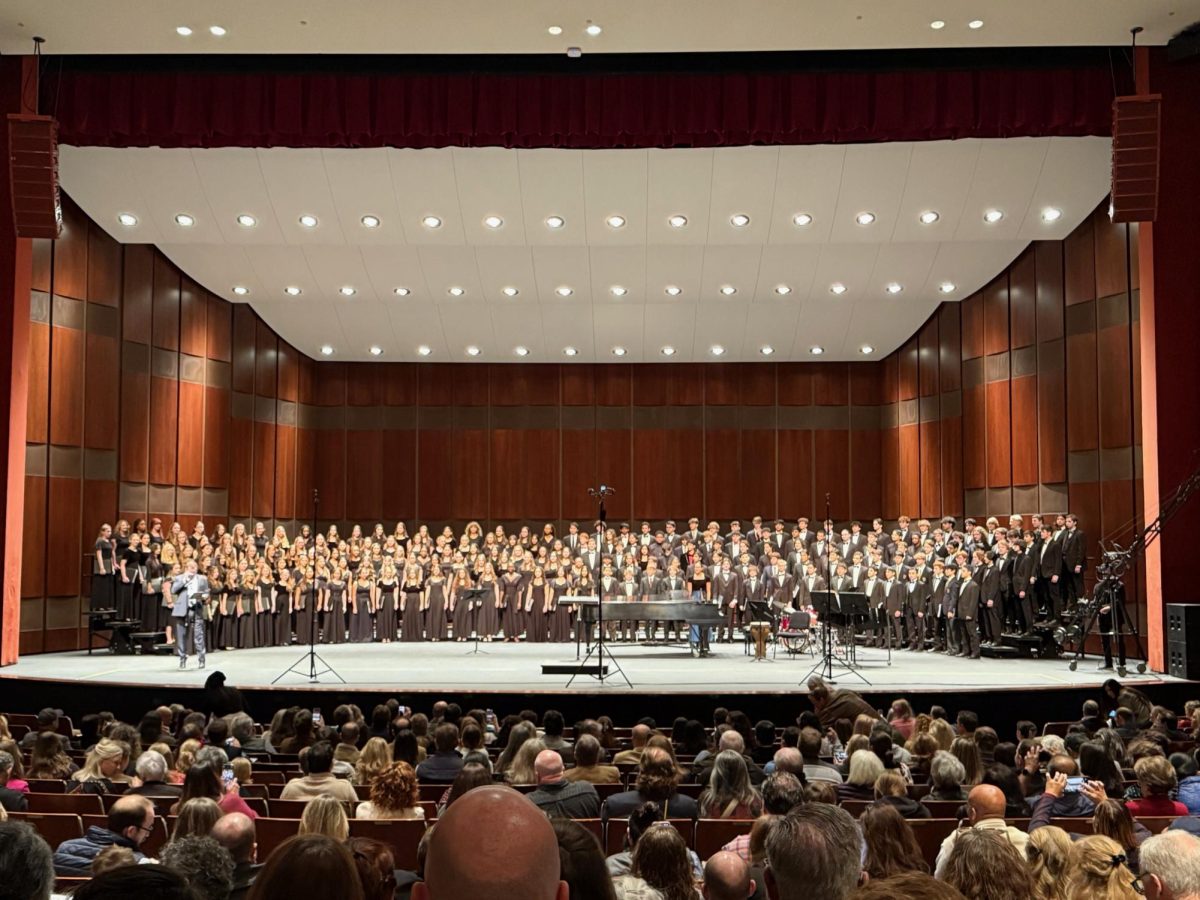 Choir director Tinsley Silcox speaks at the All State performance 