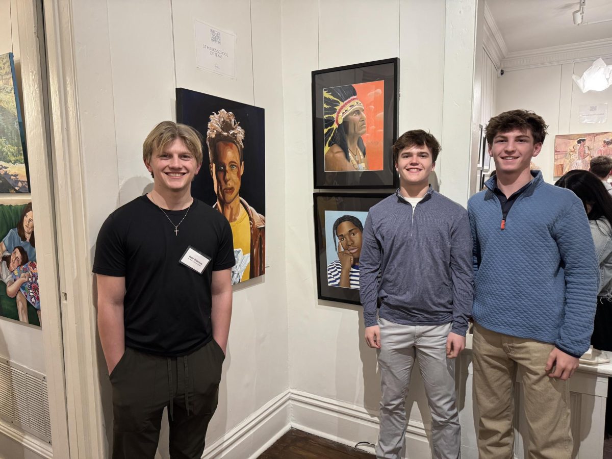 Senior Hale Peterson along with Juniors Riggs Bean and Beau Bacon pose in front of their artwork.