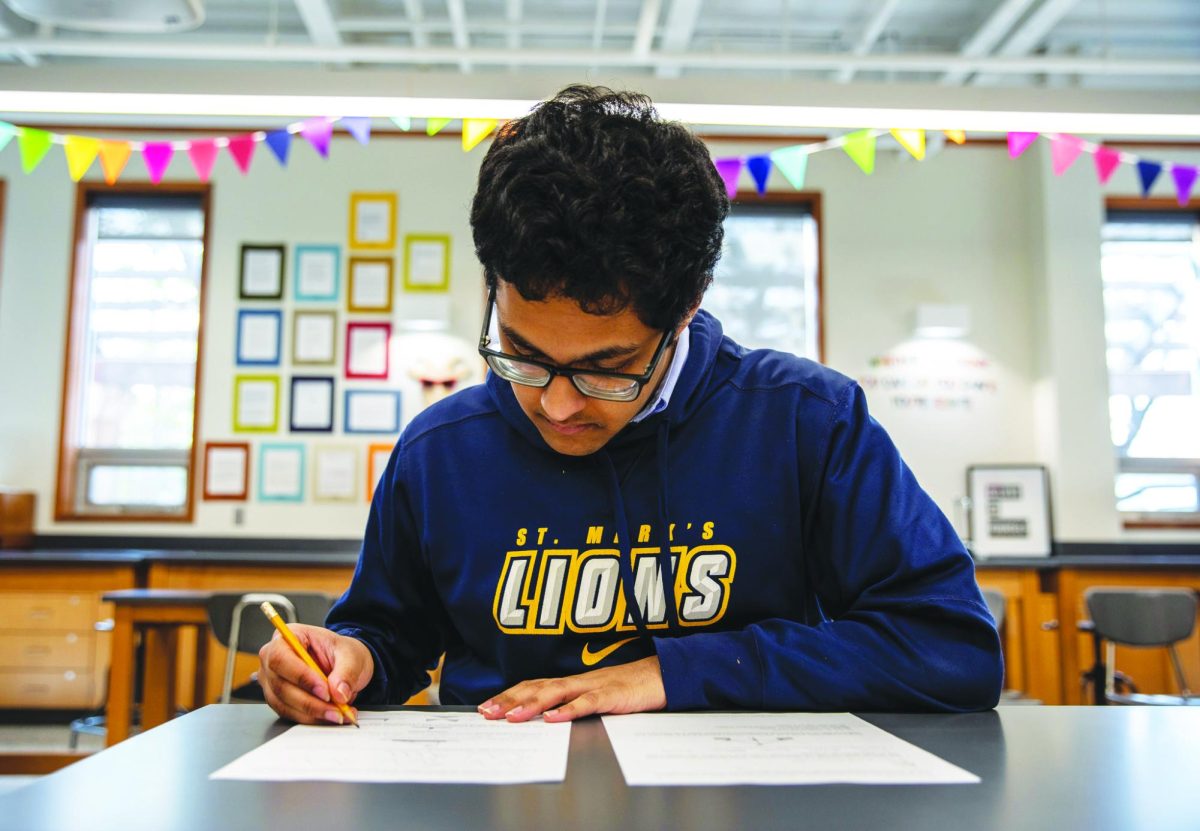 Senior Surya Dinesh takes a preliminary test for a national olympiad.