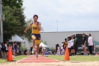 Mateu Parker takes flight during his long jump
