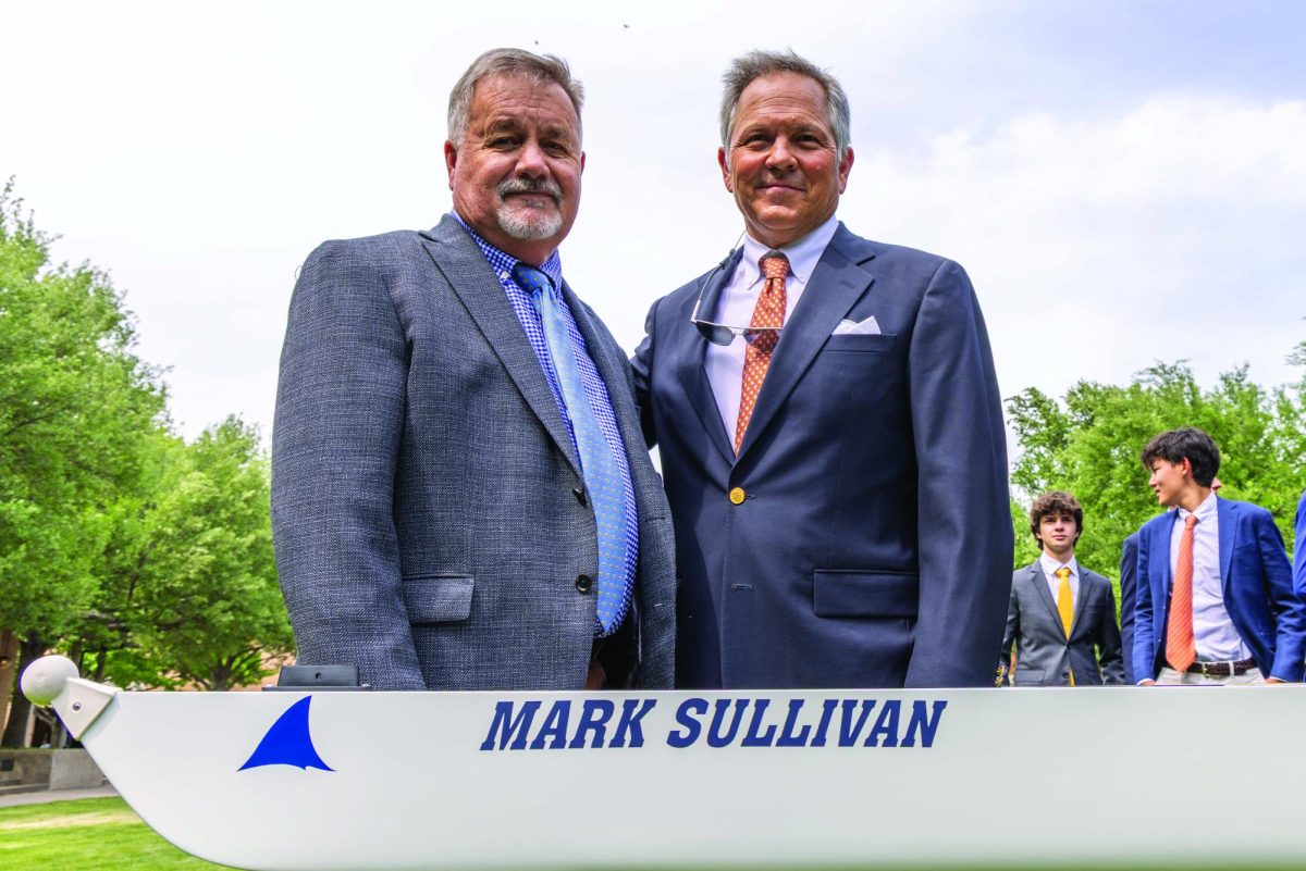 Mark Sullivan and Pitts Yandell pose in front of the new boat at its christening ceremony