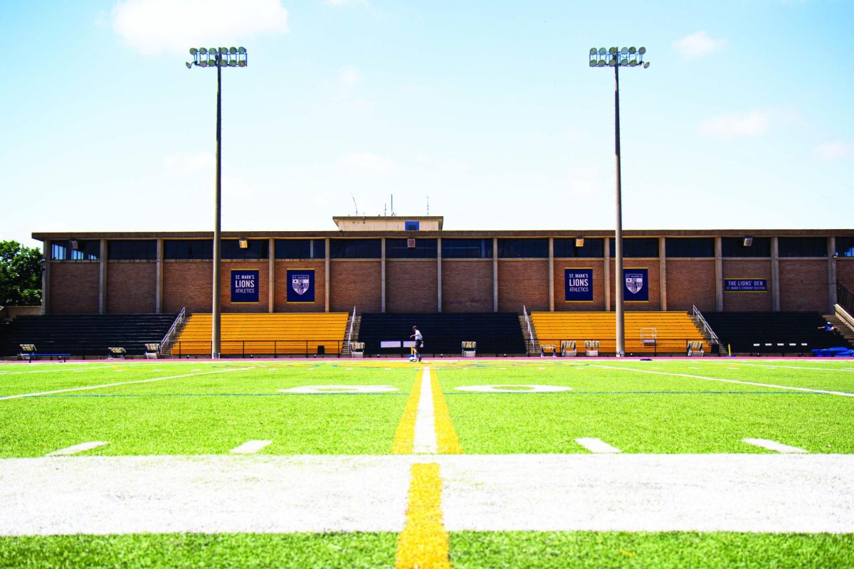 Athletes practice alone on an open soccer field