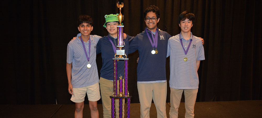 The A team with senior Surya Dinesh, junior Andy Li, sophomore Tony Lu and freshman J.P. Hanks pose after winning a trophy