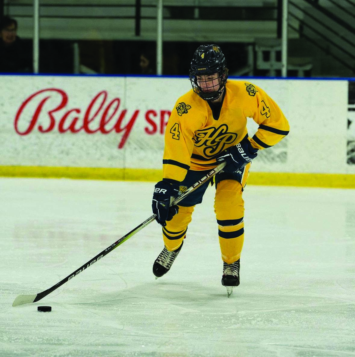 Ostella skates with the puck for Highland Park.