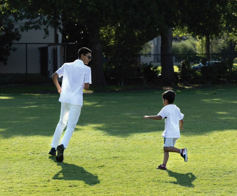 Junior Guru Aroul plays with his brother.