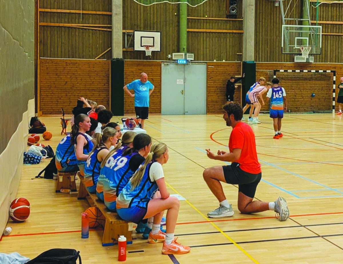 Genender offers coaching advice on the sideline