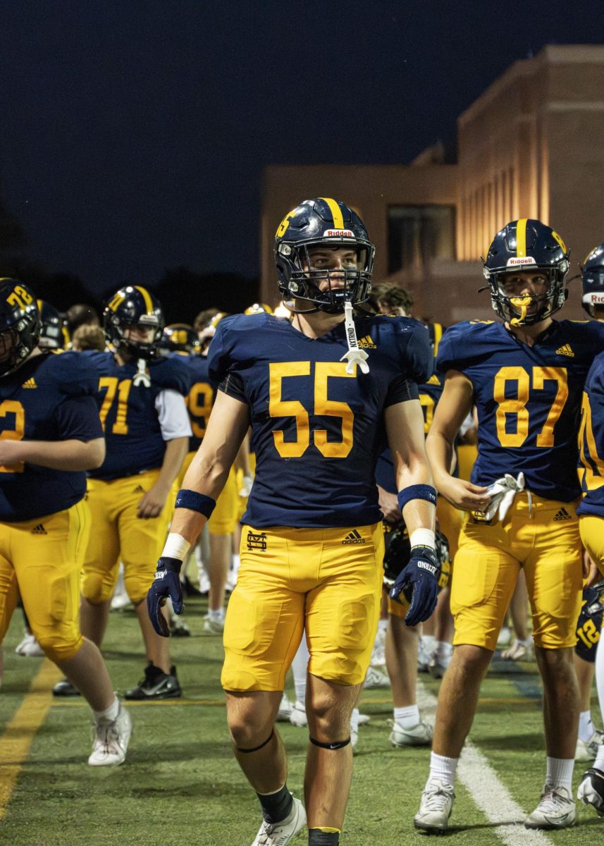 Center Brooks Main watches on from the sideline