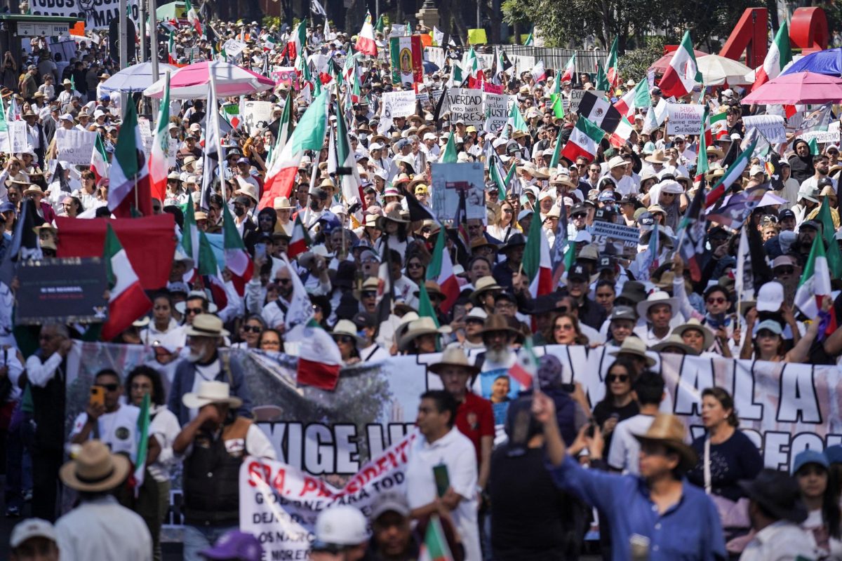 Demonstrators march to protest against insecurity and corruption in the country, in Mexico City, Mexico, November 15, 2025. 