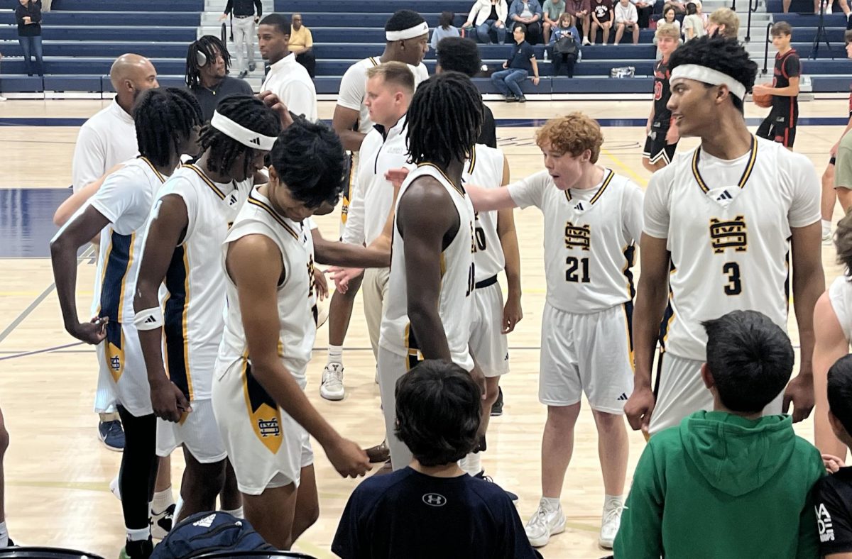 Lions players walk off the court after a close win over the Austin Prep Avengers. 