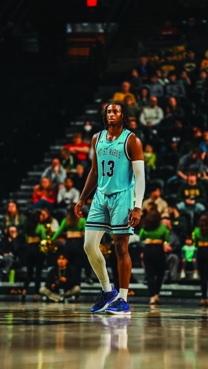 Ard scans the court after checking into an away game during his senior season. 