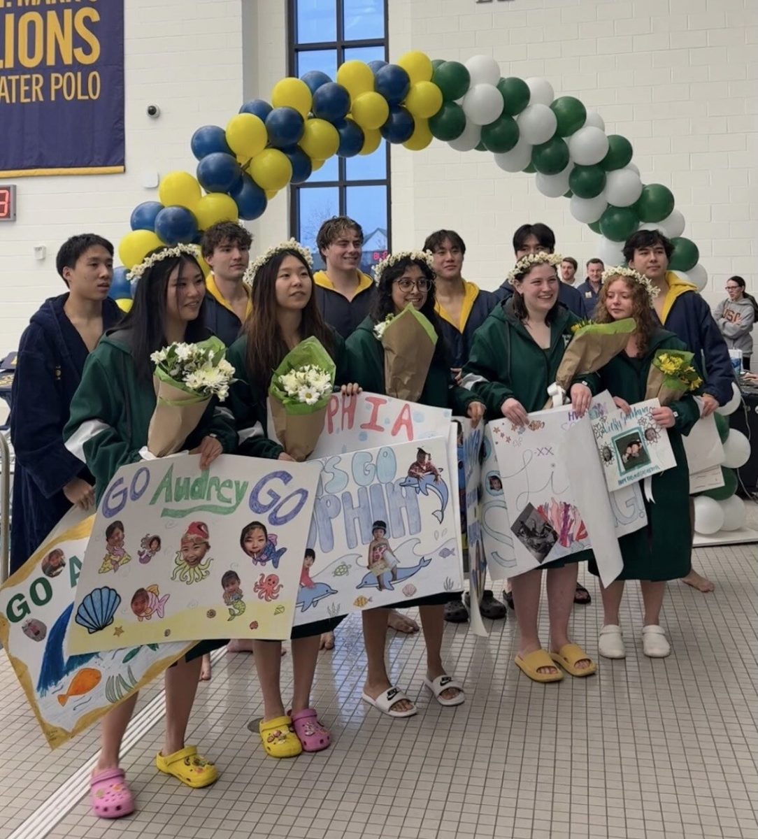 St. Mark's and Hockaday senior swimmers pose for a photo before the Senior Night  meet.