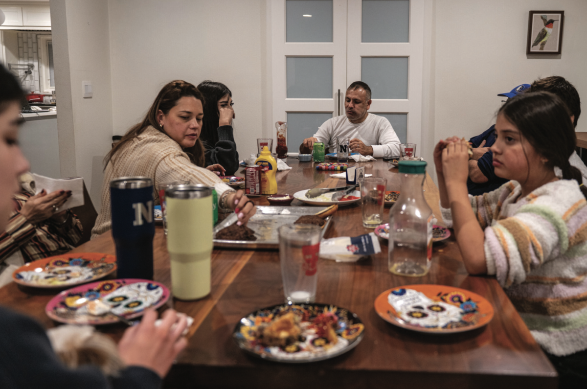 A family sits down together for quality time at dinner.