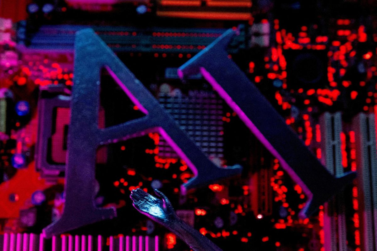 AI (Artificial Intelligence) letters and robot hand are placed on computer motherboard in this illustration created on June 23, 2023. 
