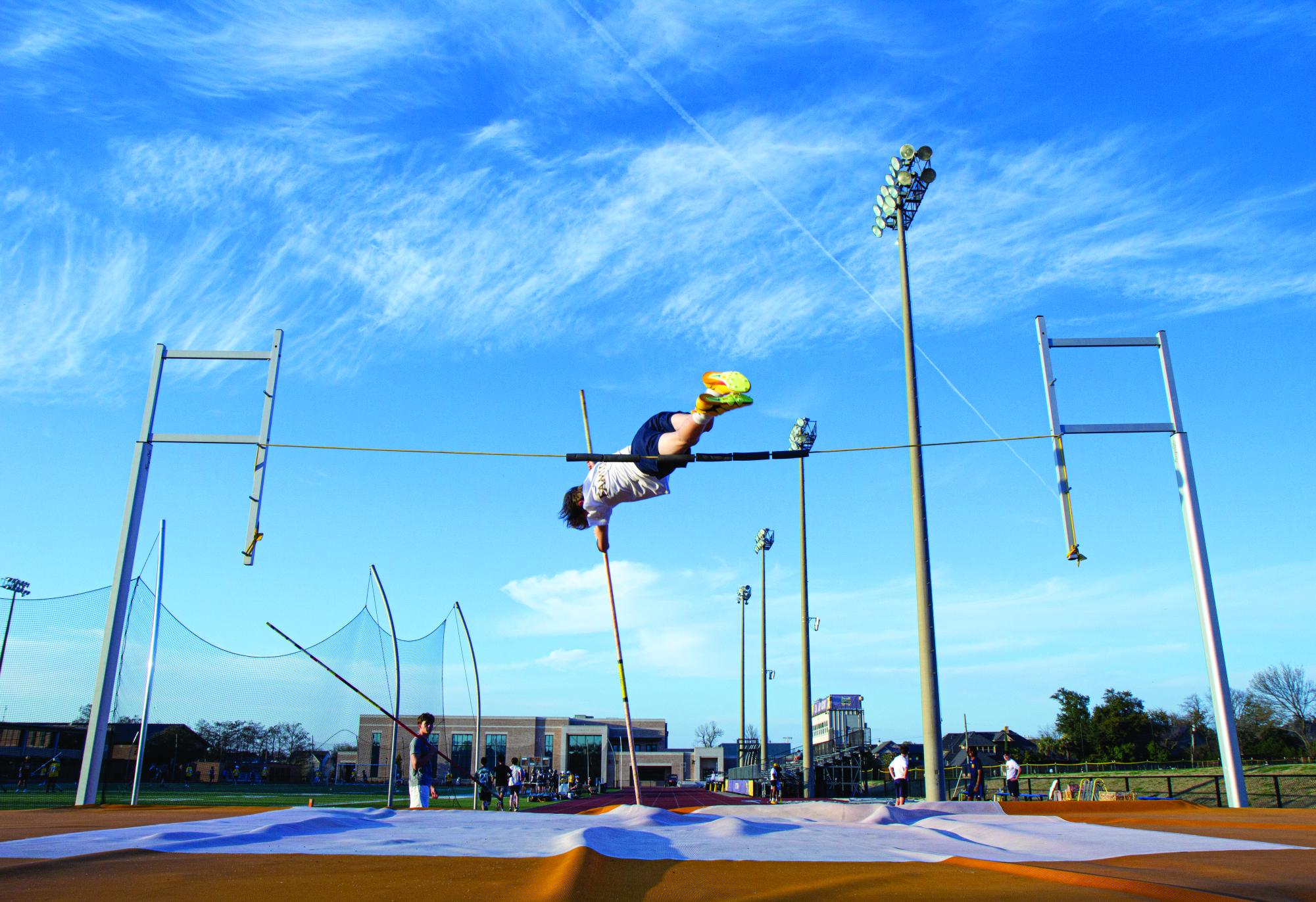 Junior Leo Hughes flies over the bar during a practice. 
