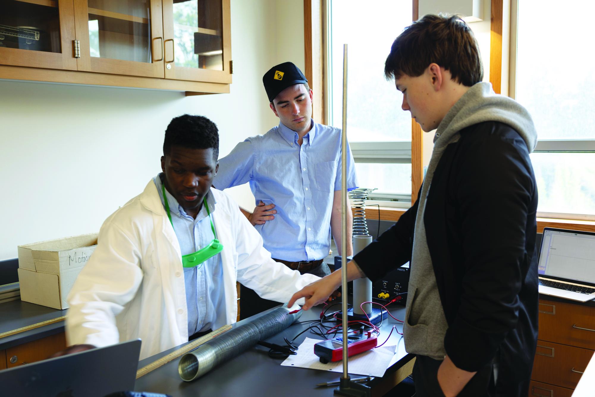 Seniors Jackson Barnes ’26, Enzo Henry ’26 and Charles McCoin ’26 use labs as a way to better grasp concepts and ideas in AP Physics C.